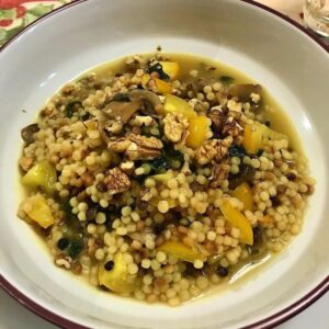 Foto della Ricetta della Fregola con Funghi, Cavolo Nero, Pomodoro Giallo e Noci