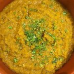 Foto della ricetta del Dahl di lenticchie rosse con curcuma, zenzero, curry, carota, cipolla e olio extravergine di oliva.